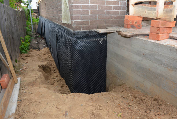 Happy homeowners after waterproofing job in Lindsey